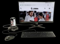 handheld mobile computer on cradle charger at workstation