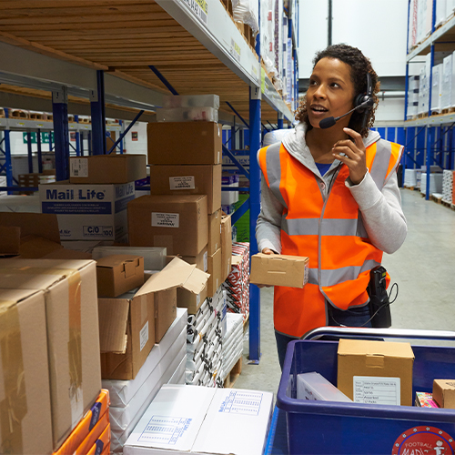 woman in warehouse with headset